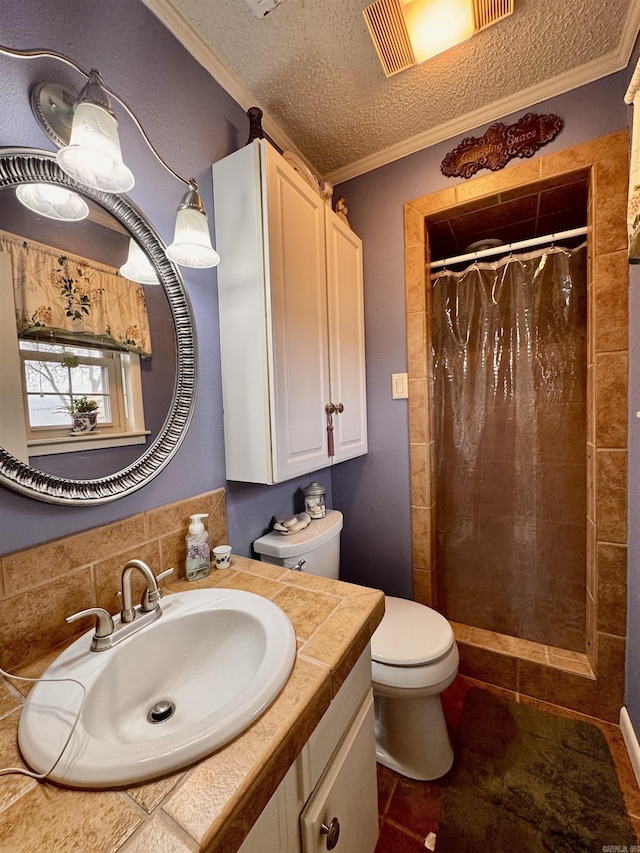 bathroom with toilet, ornamental molding, a stall shower, a textured ceiling, and vanity