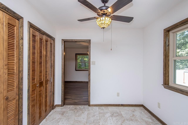 spare room featuring baseboards