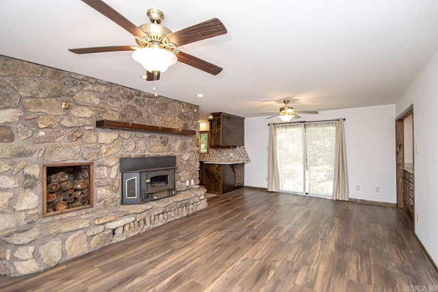 unfurnished living room with wood finished floors and baseboards