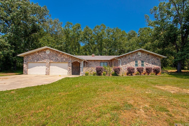 view of front of house with a garage, concrete driveway, and a front yard