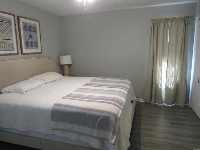 bedroom featuring wood finished floors