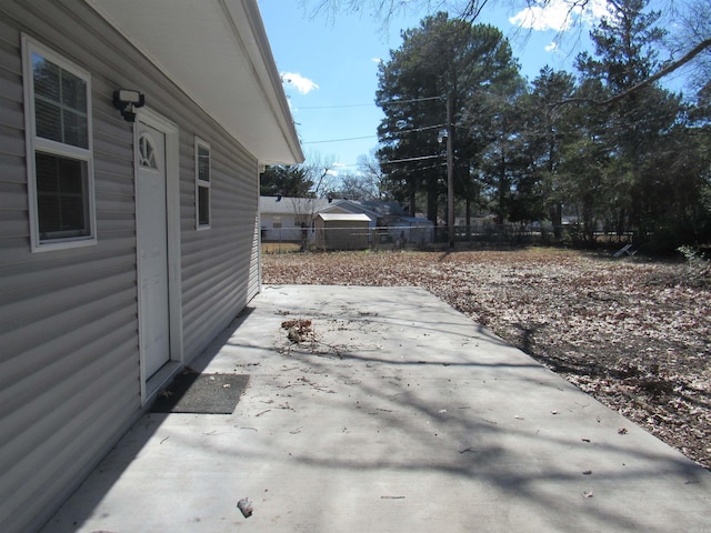 view of patio / terrace featuring fence