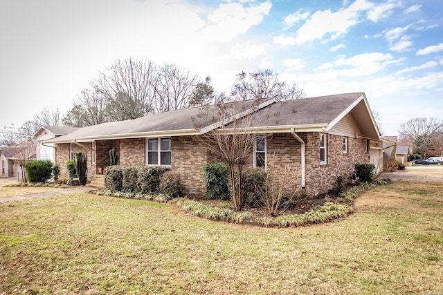 exterior space with a yard, brick siding, and crawl space