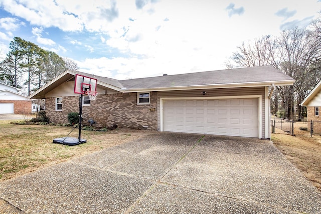 view of front facade with a garage, concrete driveway, fence, a front lawn, and brick siding