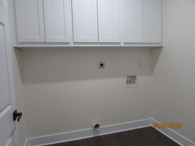 clothes washing area with dark wood-style flooring, hookup for a washing machine, cabinet space, electric dryer hookup, and baseboards