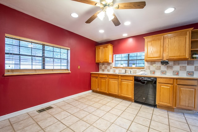 kitchen with light tile patterned flooring, visible vents, black dishwasher, light countertops, and tasteful backsplash