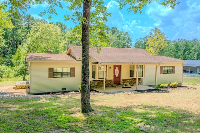 ranch-style home with a shingled roof, crawl space, a patio area, stone siding, and a front lawn