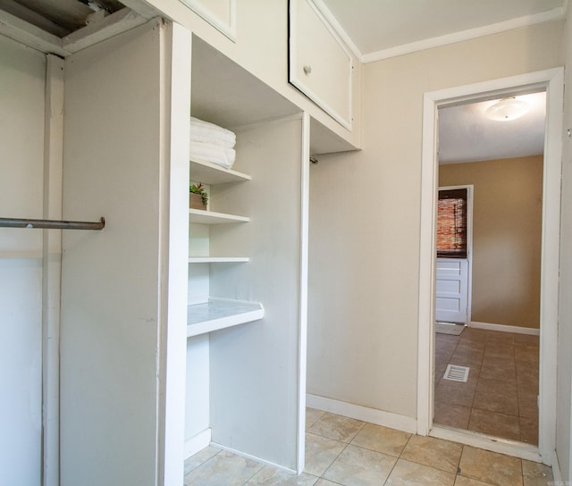 walk in closet featuring light tile patterned floors