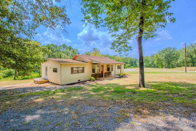 exterior space with crawl space, covered porch, and a front yard