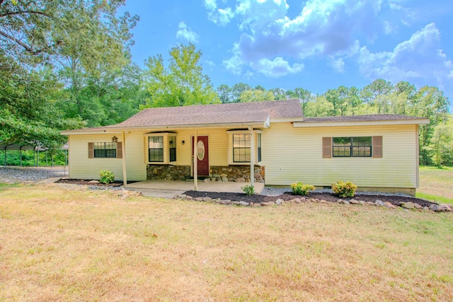 ranch-style home featuring stone siding and a front lawn