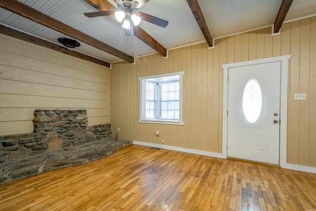 entryway with ceiling fan, visible vents, baseboards, beam ceiling, and hardwood / wood-style floors