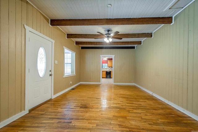 entrance foyer with a ceiling fan, beam ceiling, baseboards, and hardwood / wood-style floors