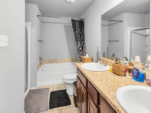 full bathroom featuring a bath, a stall shower, tile patterned flooring, and a sink