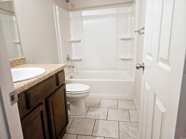 full bath featuring toilet, a textured wall, shower / tub combination, and vanity