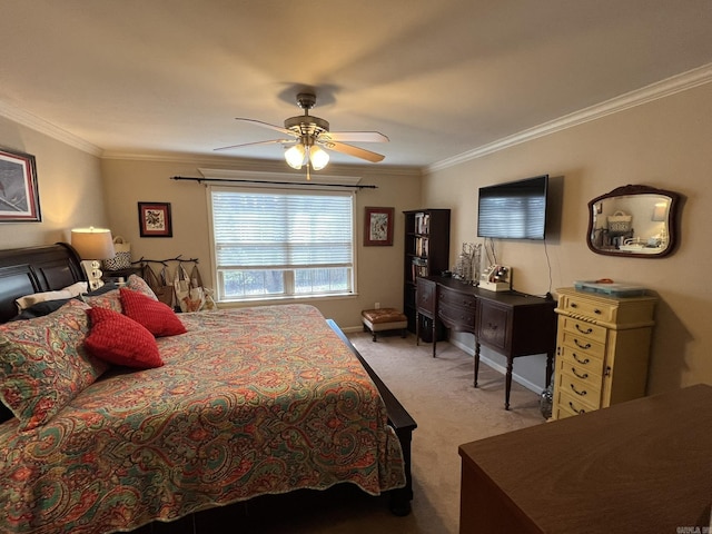 bedroom with a ceiling fan, baseboards, crown molding, and light colored carpet