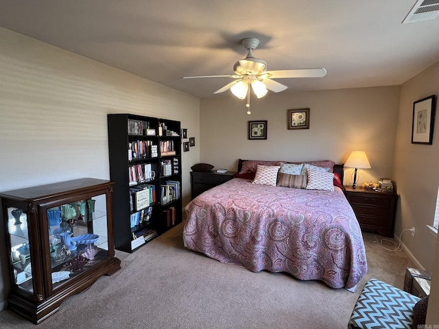 bedroom with carpet, visible vents, ceiling fan, and baseboards