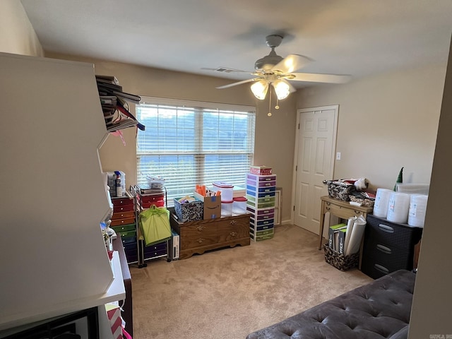 carpeted bedroom featuring a ceiling fan