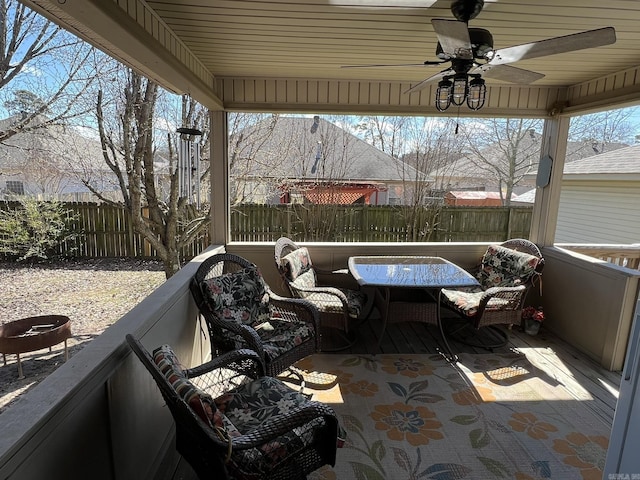 view of patio featuring ceiling fan, fence, and an outdoor hangout area