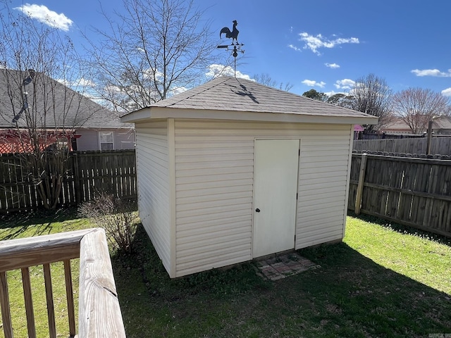 view of shed with a fenced backyard