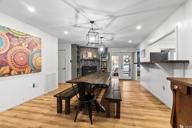 dining room featuring visible vents, french doors, light wood-style flooring, and recessed lighting