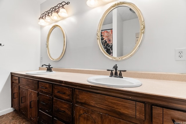 full bath featuring double vanity and a sink