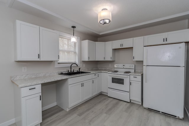 kitchen featuring white appliances, white cabinetry, light wood-style floors, and a sink