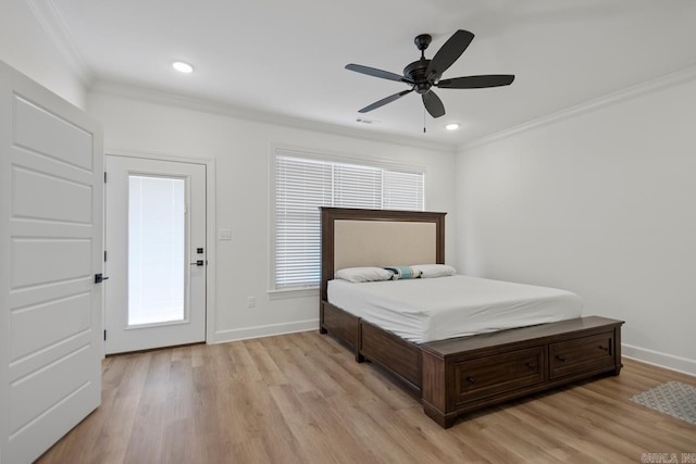 bedroom featuring baseboards, light wood-style flooring, and crown molding