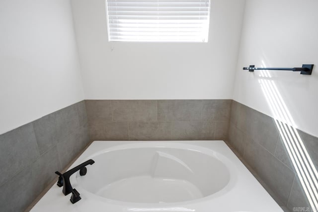 bathroom featuring a bath