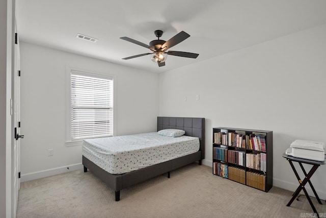 bedroom featuring baseboards, visible vents, ceiling fan, and carpet flooring