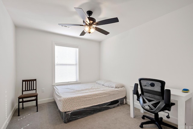 bedroom with carpet floors, visible vents, baseboards, and a ceiling fan