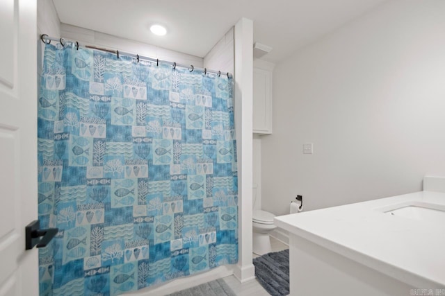 bathroom featuring vanity, toilet, and a shower with curtain