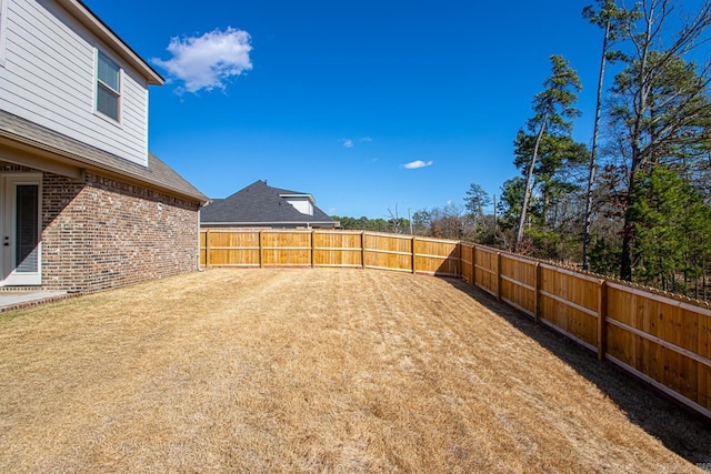 view of yard featuring a fenced backyard