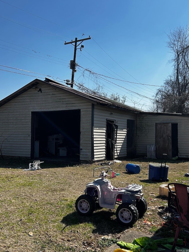 view of outbuilding with a garage and an outdoor structure