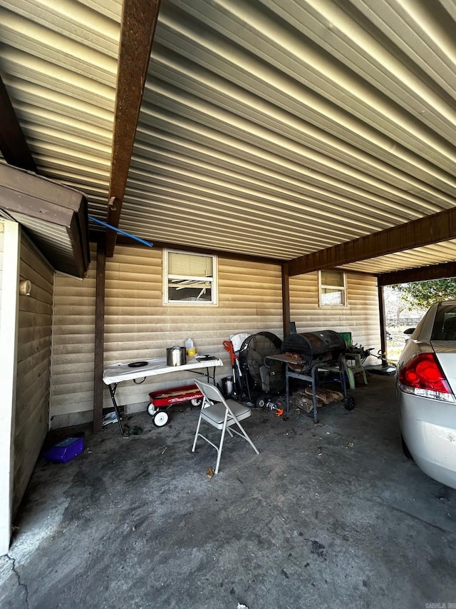 view of parking with an attached carport