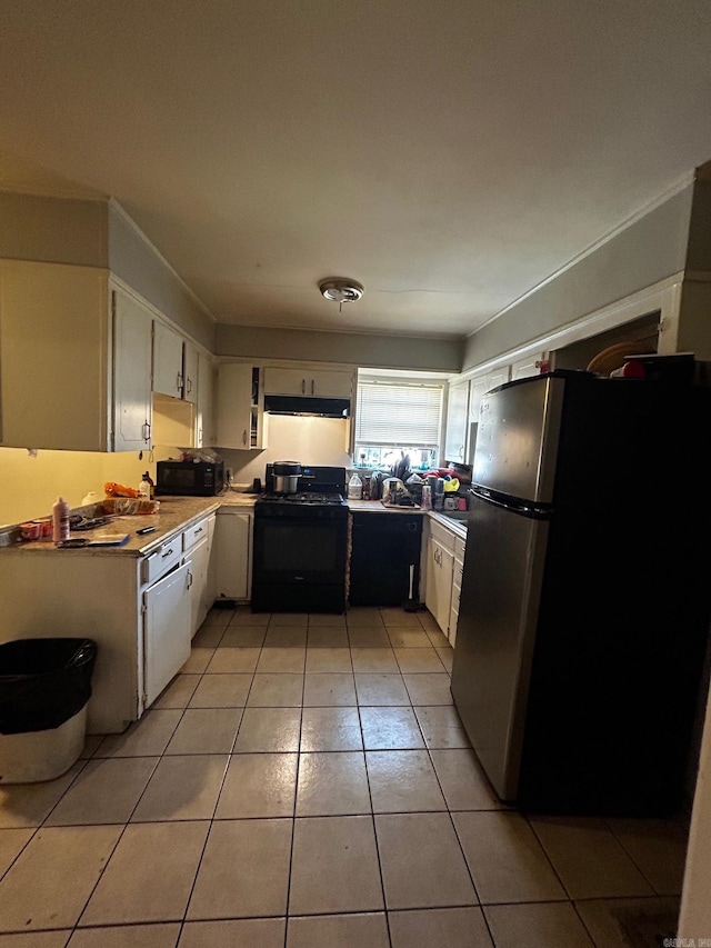 kitchen with black appliances, light tile patterned floors, under cabinet range hood, and white cabinets