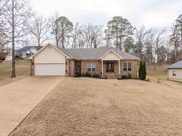 ranch-style house with a garage, brick siding, driveway, and a front lawn