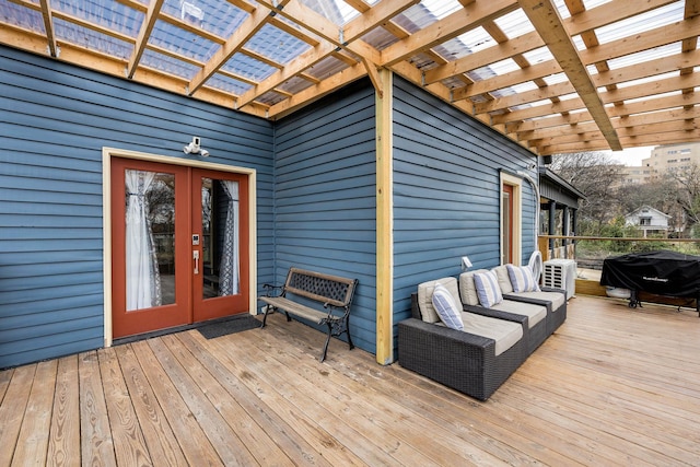 deck with french doors, an outdoor hangout area, area for grilling, and a pergola