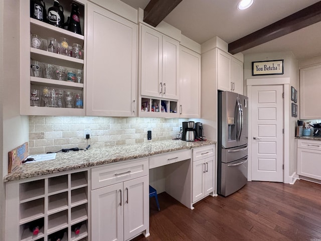 kitchen with dark wood finished floors, white cabinets, decorative backsplash, open shelves, and stainless steel fridge