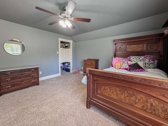 bedroom with light carpet, baseboards, vaulted ceiling, and a ceiling fan