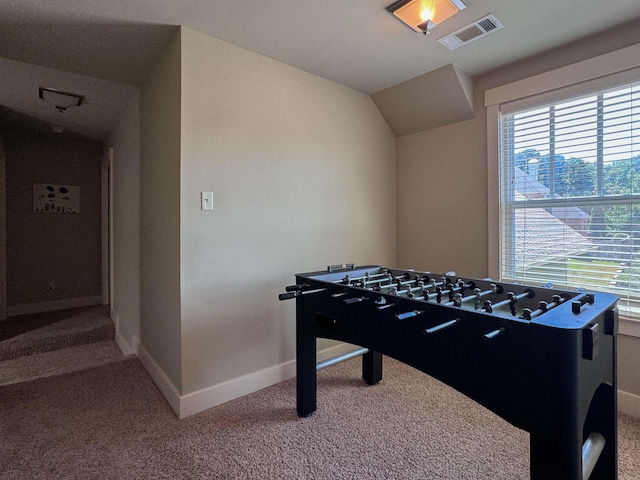 playroom featuring baseboards, visible vents, vaulted ceiling, and carpet flooring