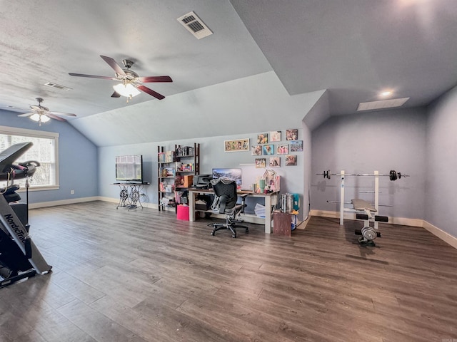 home office with lofted ceiling, baseboards, visible vents, and wood finished floors