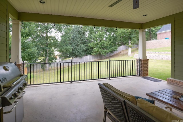 view of patio / terrace with a fenced backyard and a grill