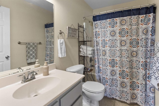 full bathroom with a shower with curtain, vanity, toilet, and tile patterned floors