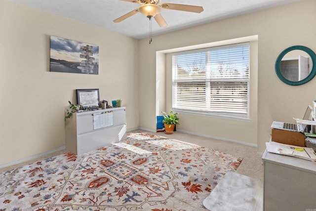 bedroom featuring ceiling fan, carpet flooring, and baseboards