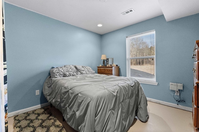 bedroom with visible vents and baseboards