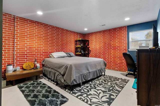 bedroom with recessed lighting, visible vents, and concrete floors