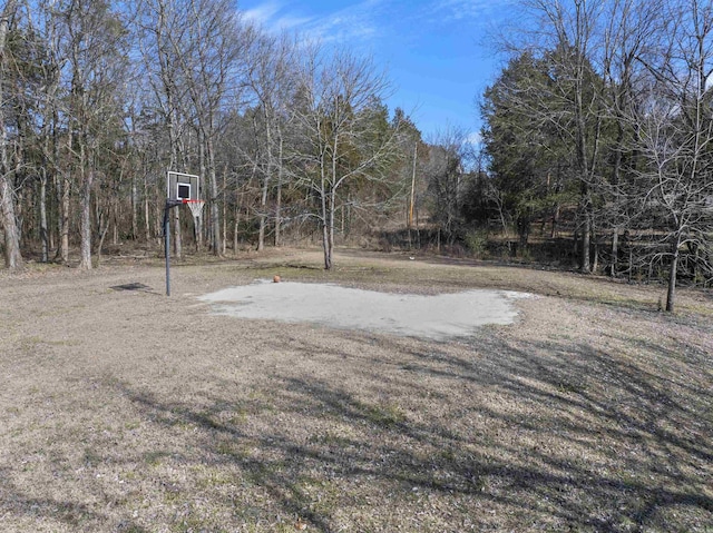 view of yard featuring community basketball court