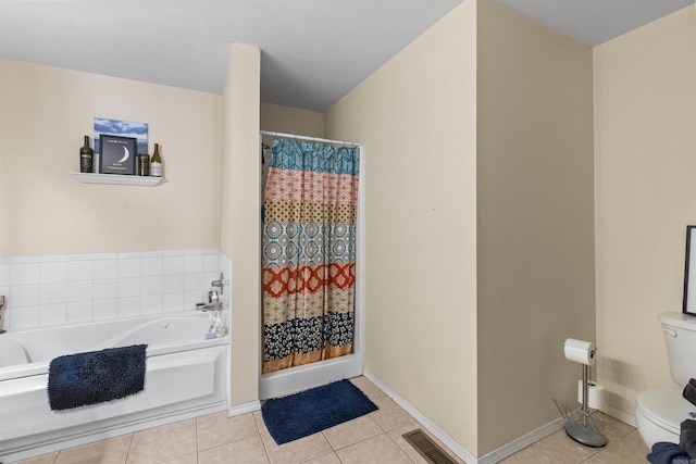 full bath with visible vents, toilet, a shower with curtain, tile patterned floors, and a garden tub