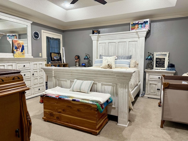 bedroom with light carpet, ceiling fan, a raised ceiling, and crown molding