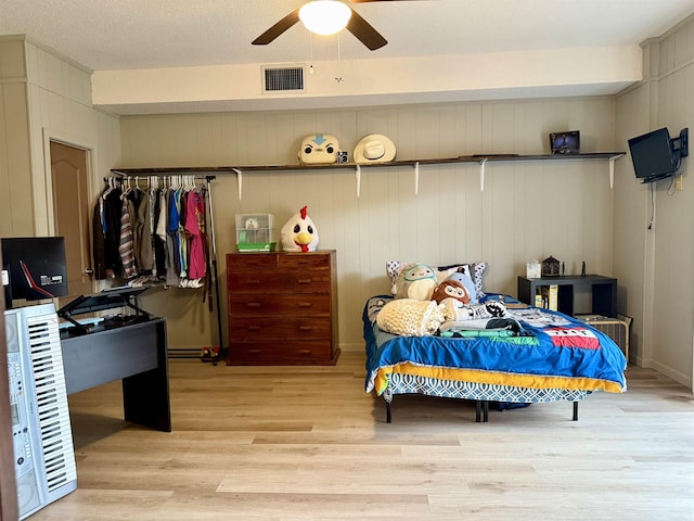 bedroom featuring visible vents and light wood-style floors